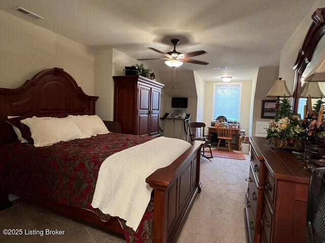 carpeted bedroom with ceiling fan