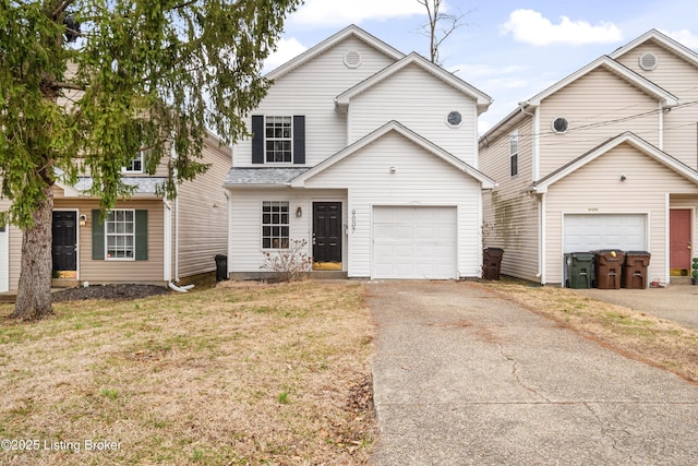 view of front property with a garage and a front yard