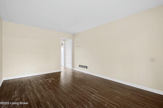 empty room featuring hardwood / wood-style flooring