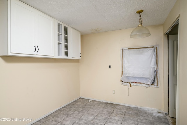 empty room featuring a textured ceiling