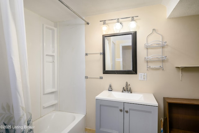 bathroom featuring vanity and shower / bath combo with shower curtain