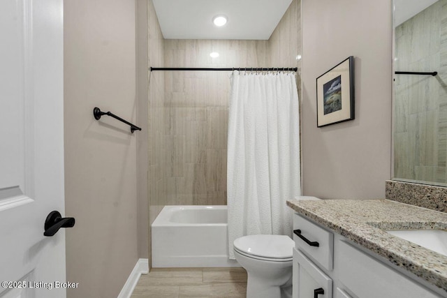 bathroom featuring vanity, toilet, and shower / bathtub combination with curtain