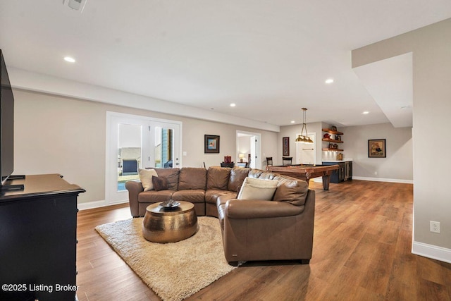 living room featuring recessed lighting, pool table, baseboards, and wood finished floors