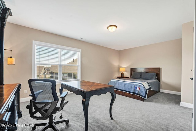 bedroom with baseboards and carpet