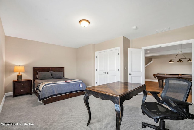 bedroom with a closet, baseboards, and visible vents