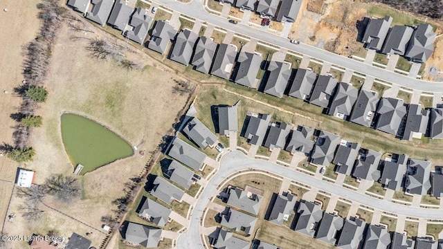 birds eye view of property with a residential view