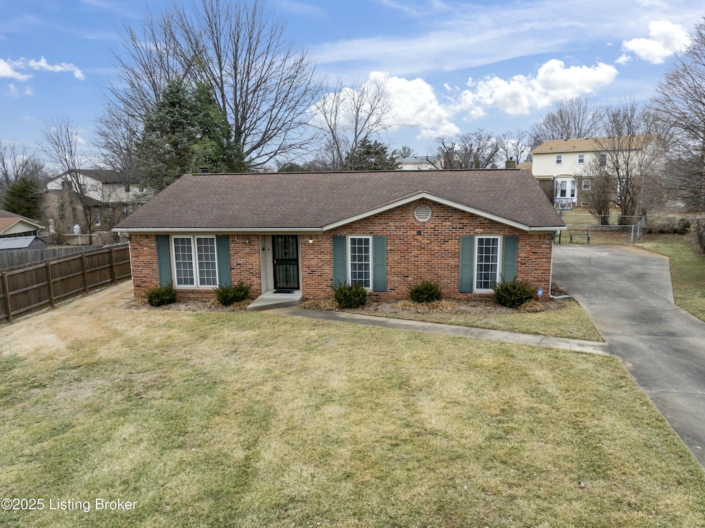 ranch-style house with a front yard