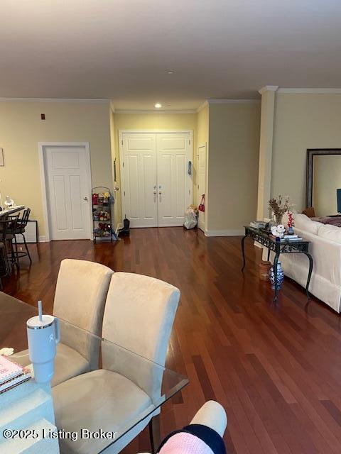324 E Main St Unit 405, Louisville, KY 40202 - living room featuring crown molding and dark wood-type flooring