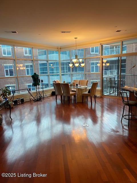 324 E Main St Unit 405, Louisville, KY 40202 - dining space featuring hardwood / wood-style flooring and a chandelier