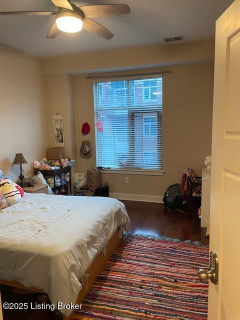 324 E Main St Unit 405, Louisville, KY 40202 - bedroom with ceiling fan and dark hardwood / wood-style floors