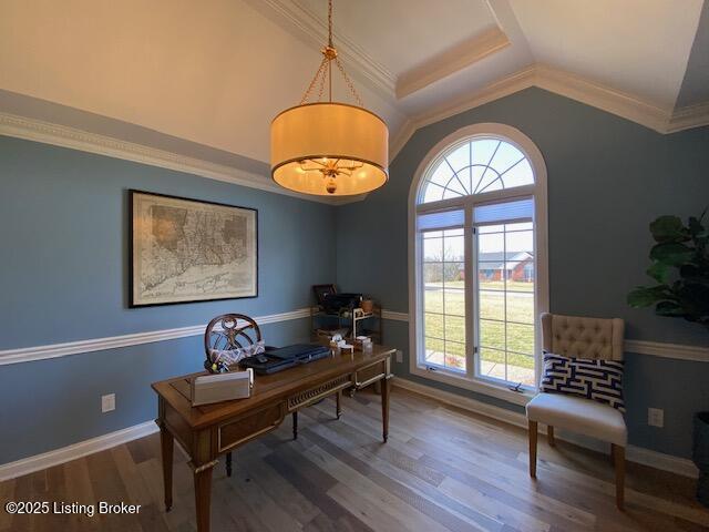 office with ornamental molding, wood-type flooring, and vaulted ceiling