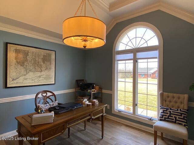 home office with ornamental molding and wood-type flooring