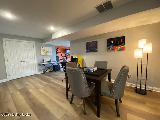 dining space featuring light hardwood / wood-style floors