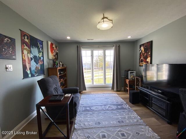 sitting room featuring light hardwood / wood-style floors