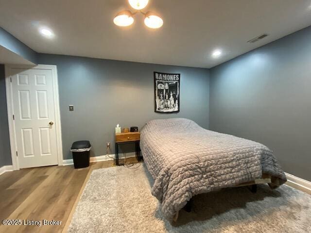 bedroom featuring wood-type flooring