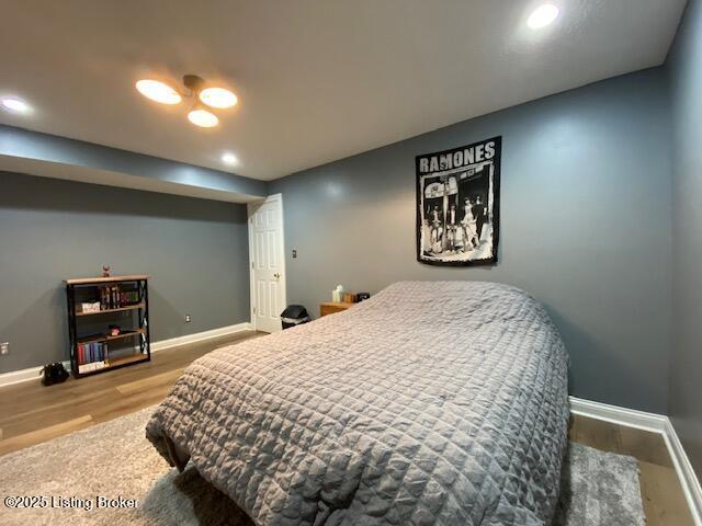 bedroom with wood-type flooring