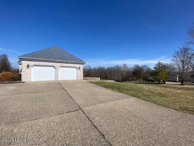 view of property exterior featuring a garage and a lawn