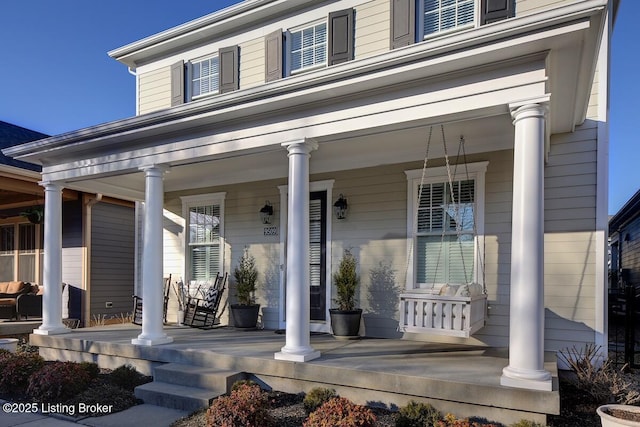 entrance to property featuring a porch