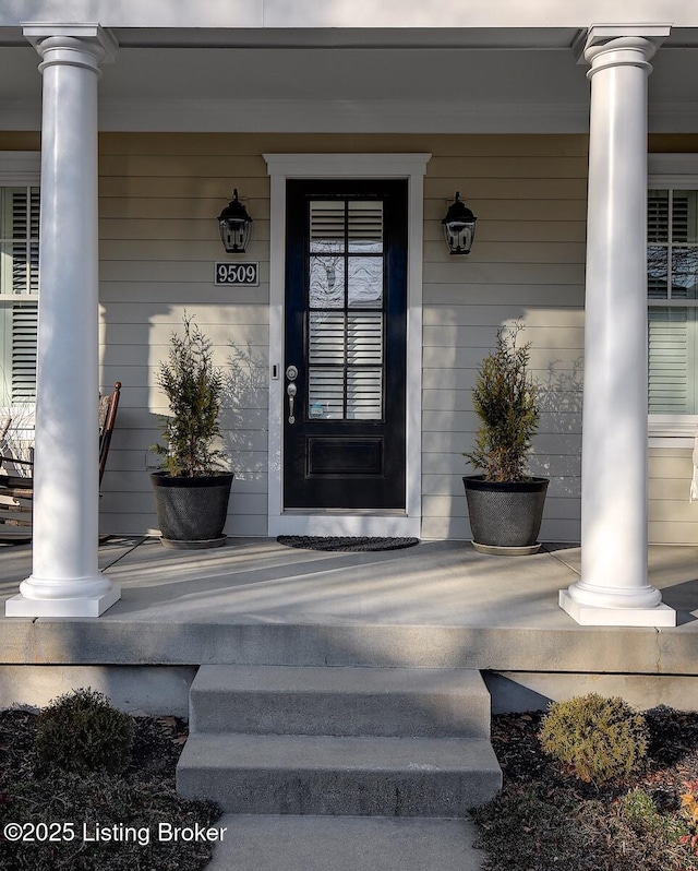 property entrance with covered porch