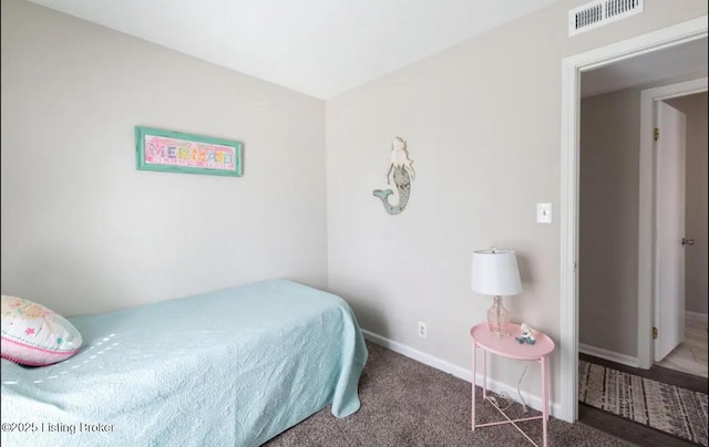 bedroom with dark carpet