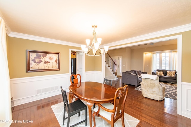 110 E Mandarin Ct, Elizabethtown, KY 42701 - dining area featuring an inviting chandelier, crown molding, and dark wood-type flooring