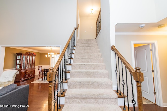 110 E Mandarin Ct, Elizabethtown, KY 42701 - stairs featuring hardwood / wood-style floors, a notable chandelier, and ornamental molding