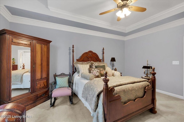 bedroom with crown molding, light carpet, and ceiling fan