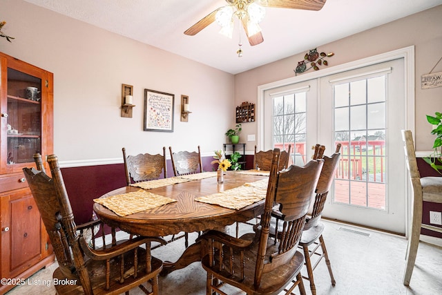 dining room with french doors and ceiling fan