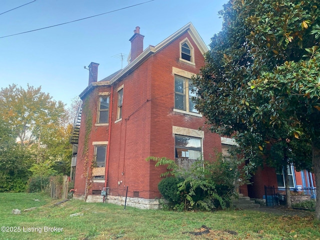 view of property exterior featuring a yard