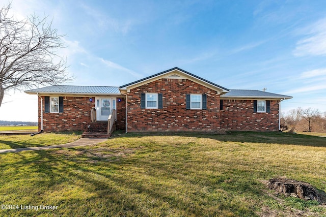 ranch-style home with a front yard