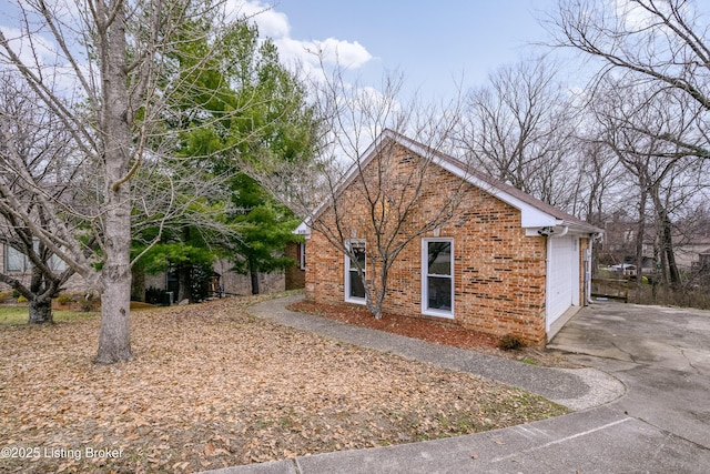 view of side of property with a garage