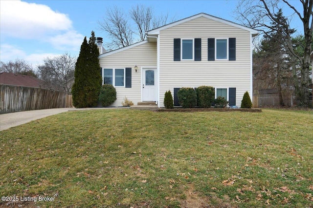 split level home featuring a front yard