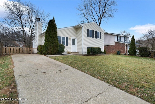 view of side of property with a yard