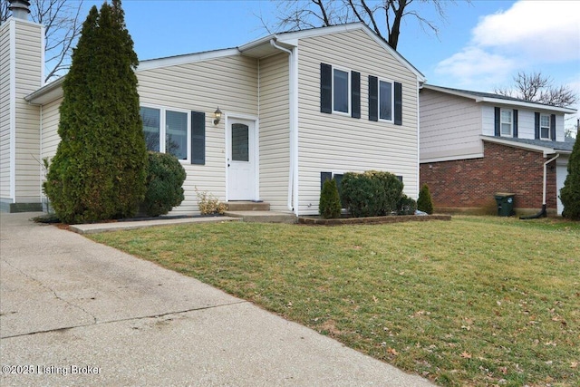 tri-level home featuring a front yard