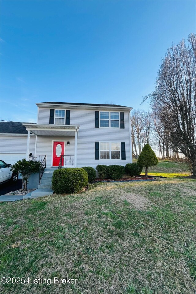 223 Lea Ct, Rineyville, KY 40162 - traditional-style home with a front yard and a garage
