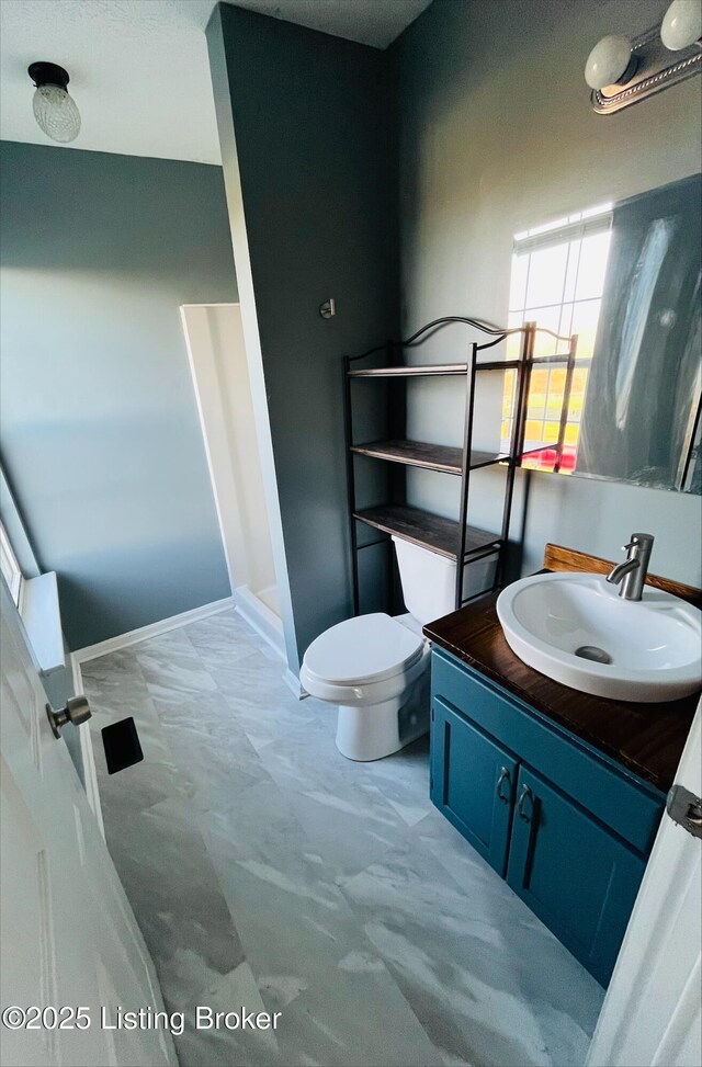 223 Lea Ct, Rineyville, KY 40162 - full bathroom with toilet, a stall shower, vanity, and baseboards