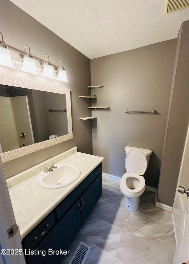 223 Lea Ct, Rineyville, KY 40162 - bathroom featuring vanity, baseboards, visible vents, a textured ceiling, and toilet