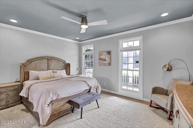 bedroom featuring crown molding, ceiling fan, and light carpet