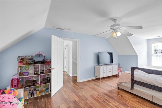 bedroom with vaulted ceiling, ceiling fan, and light wood-type flooring