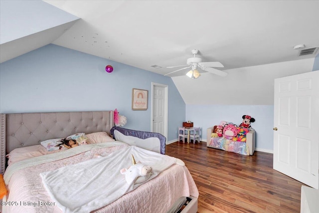 bedroom with hardwood / wood-style floors, vaulted ceiling, and ceiling fan