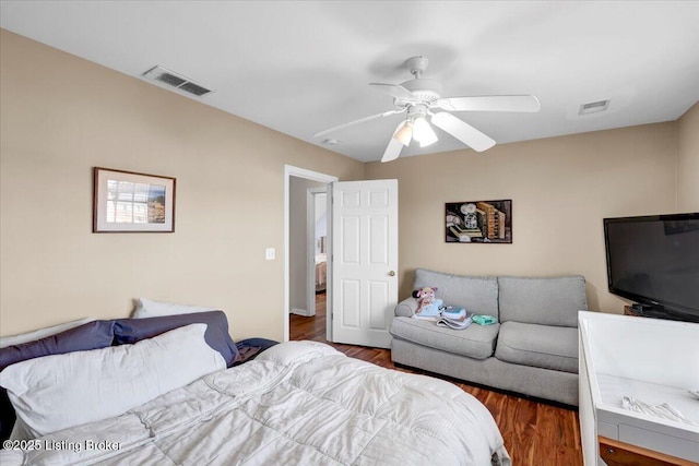 bedroom featuring ceiling fan and dark hardwood / wood-style flooring