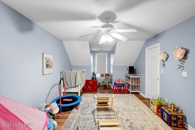 game room featuring wood-type flooring, vaulted ceiling, and ceiling fan