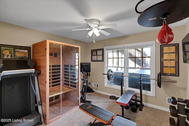 workout room featuring carpet floors and ceiling fan