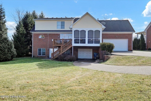 front of property featuring a garage, a front yard, a sunroom, and a deck