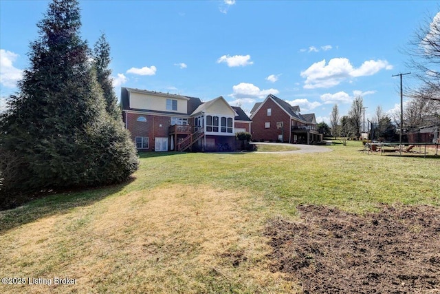 view of yard with a trampoline