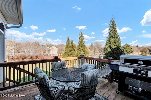 wooden terrace featuring area for grilling