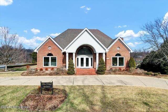 view of front property with a front lawn