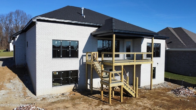 rear view of property with a deck