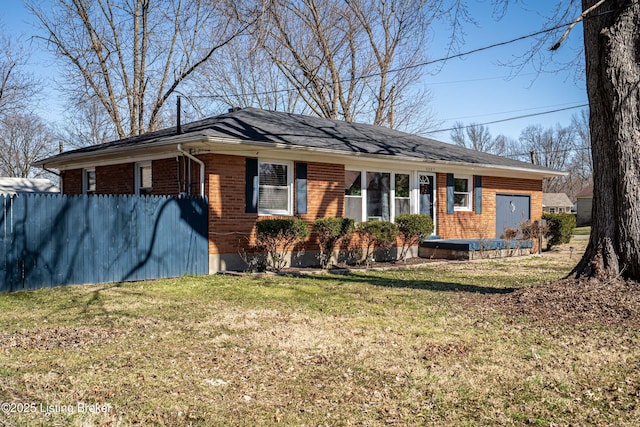 single story home with a front lawn and brick siding