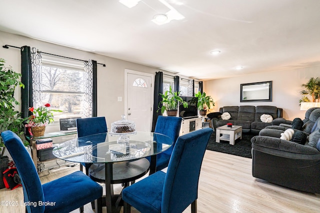 dining area with light wood-style flooring